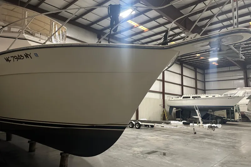 Slide: The Image of 1989 Egg Harbor 37 Convertible boat in indoor storage facility. - 14