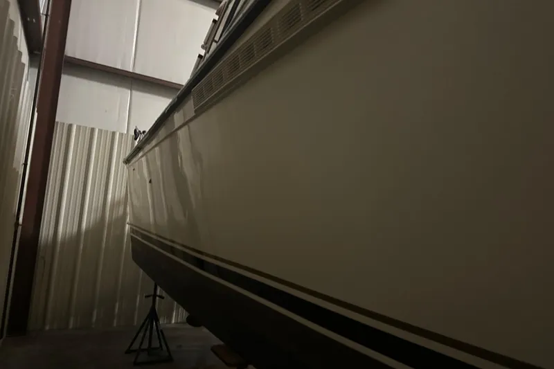 Slide: The Image of 1989 Egg Harbor 37 Convertible boat in storage, side view. - 15