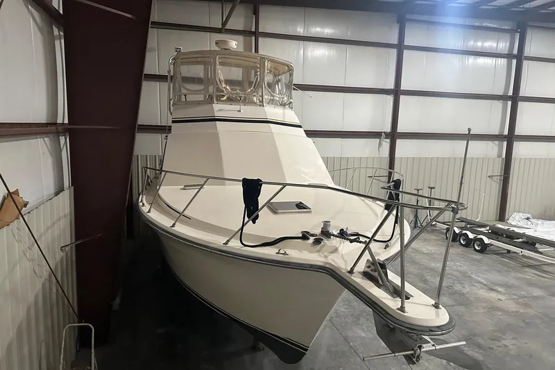 Slide: The Image of 1989 Egg Harbor 37 Convertible boat in indoor storage facility. - 2