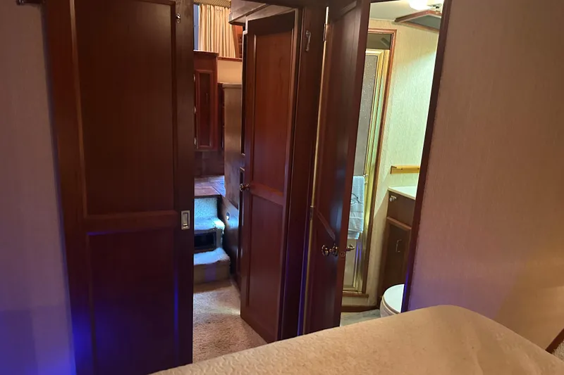 Slide: The Image of Interior view of 1989 Egg Harbor 37 Convertible yacht, featuring wooden doors and cozy cabin space. - 20
