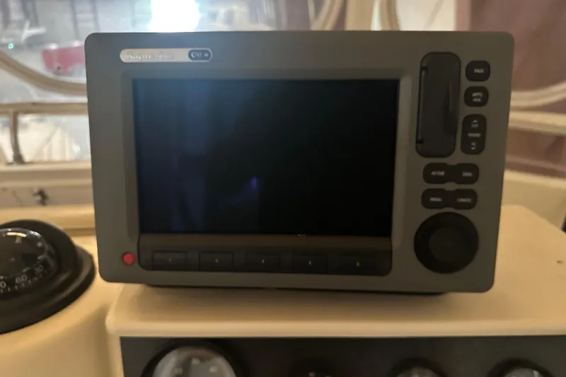 Slide: The Image of Navigation system on 1989 Egg Harbor 37 Convertible boat dashboard. - 34