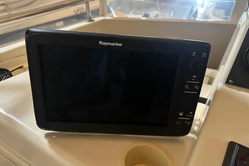 Slide: The Image of Raymarine navigation system on 1989 Egg Harbor 37 Convertible boat dashboard. - 36