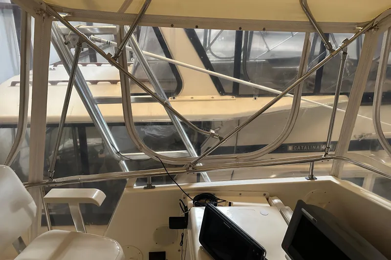 Slide: The Image of Interior view of 1989 Egg Harbor 37 Convertible boat cockpit with seating and equipment. - 40