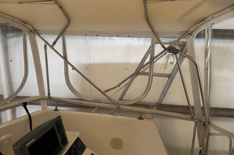 Slide: The Image of Interior view of 1989 Egg Harbor 37 Convertible boat with navigation equipment. - 42