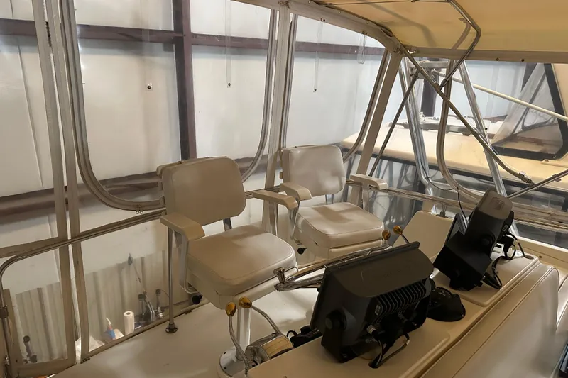 Slide: The Image of 1989 Egg Harbor 37 Convertible helm with dual seats and navigation equipment. - 43