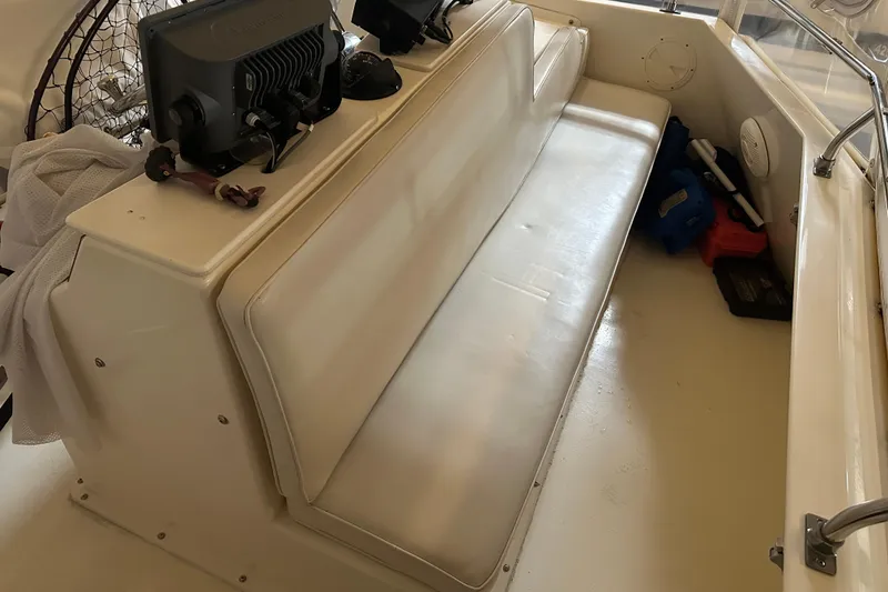 Slide: The Image of Interior seating of 1989 Egg Harbor 37 Convertible boat with navigation equipment. - 45