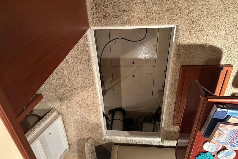 Slide: The Image of Interior view of 1989 Egg Harbor 37 Convertible engine compartment access. - 48