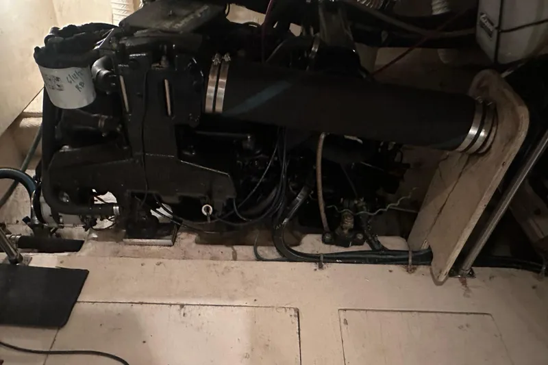 Slide: The Image of Engine compartment of a 1989 Egg Harbor 37 Convertible boat, showcasing mechanical components. - 50