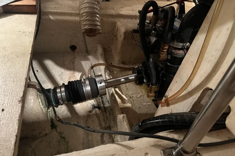 Slide: The Image of Engine compartment of a 1989 Egg Harbor 37 Convertible boat, showing mechanical components. - 53