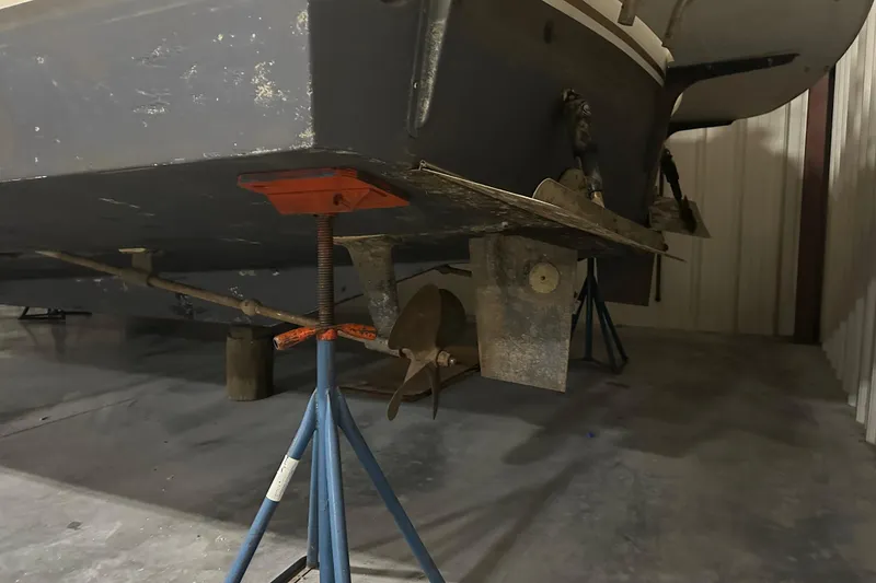 Slide: The Image of 1989 Egg Harbor 37 Convertible boat on stands in a storage facility. - 67