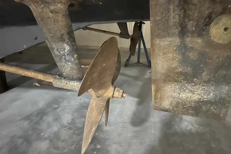 Slide: The Image of Propeller and rudder of 1989 Egg Harbor 37 Convertible boat in dry dock. - 68