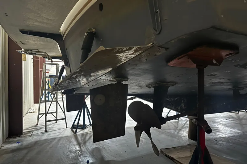 Slide: The Image of 1989 Egg Harbor 37 Convertible boat underside in maintenance facility. - 70