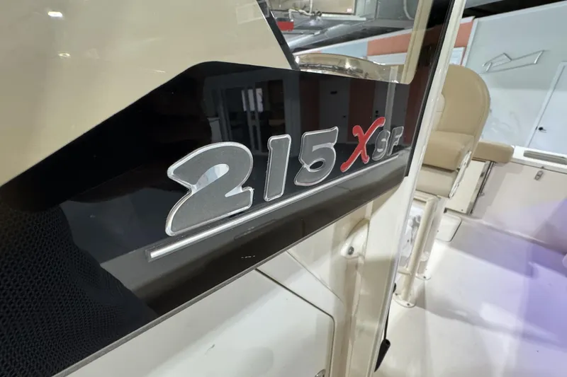 Slide: The Image of 2023 Scout 215 XSF boat interior with model emblem detail. - 11