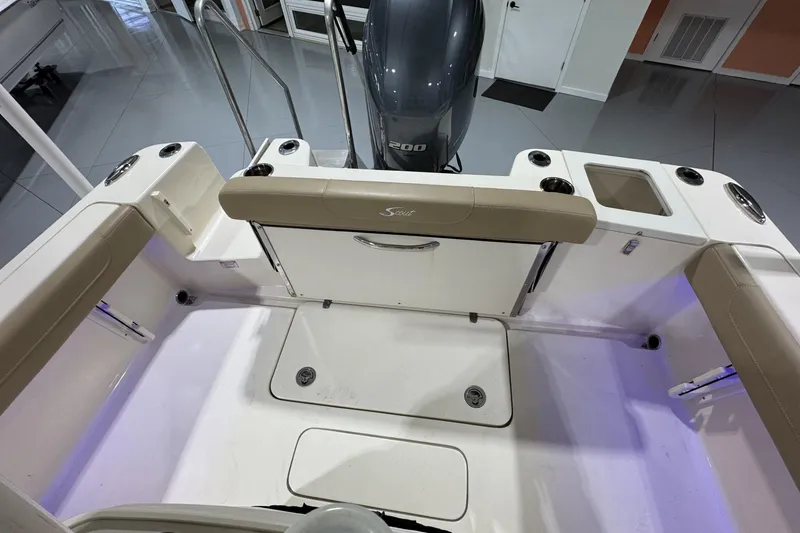 Slide: The Image of 2023 Scout 215 XSF boat interior with seating and storage compartments. - 5