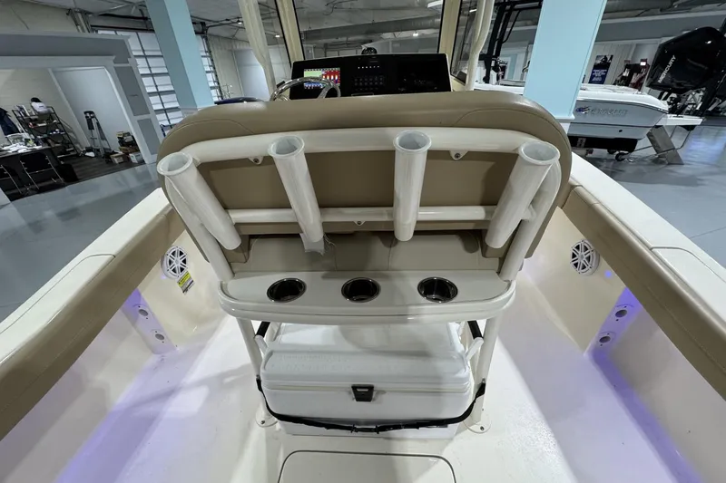 Slide: The Image of 2023 Scout 215 XSF boat interior with rod holders and cup holders. - 7