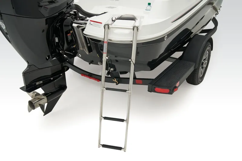 Slide: The Image of 2018 Tahoe 450 TS boat with ladder and outboard motor on trailer. - 5