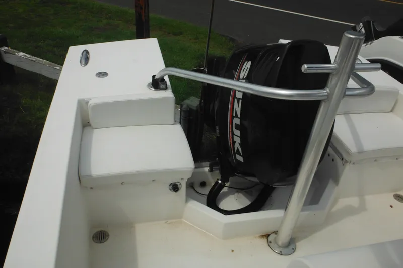 Slide: The Image of 2006 DC 23 Brown Custom CC boat with Suzuki outboard motor and white seating. - 14