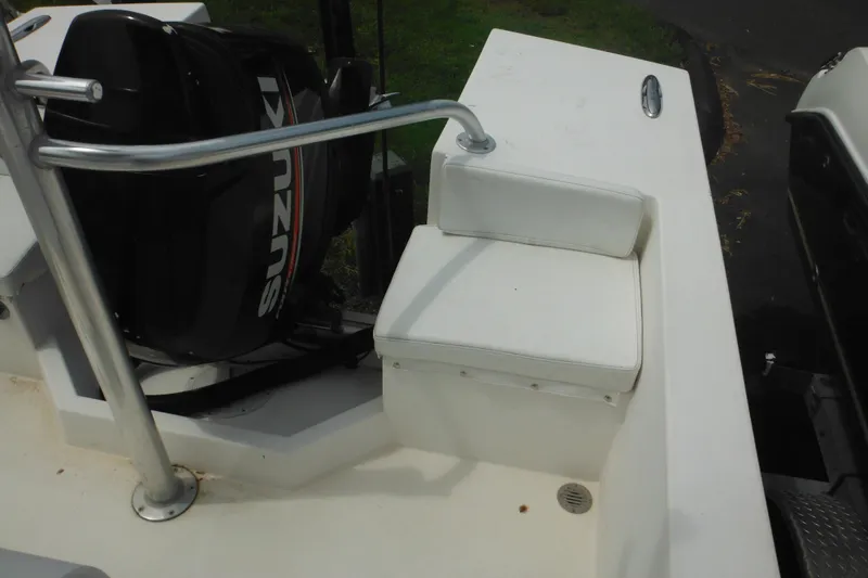 Slide: The Image of 2006 DC 23 Brown Custom CC boat with Suzuki outboard motor and white seating. - 15