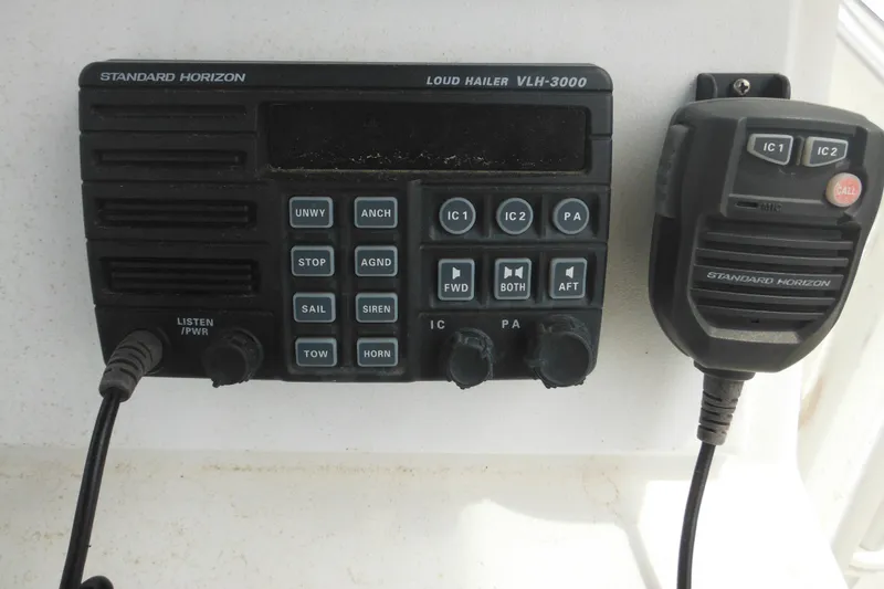 Slide: The Image of Standard Horizon VLH-3000 marine radio with microphone, mounted on a 2006 DC 23 Brown Custom CC. - 19