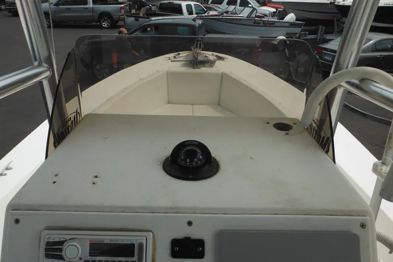 Slide: The Image of 2006 DC 23 Brown Custom CC boat dashboard with compass and control panel. - 22