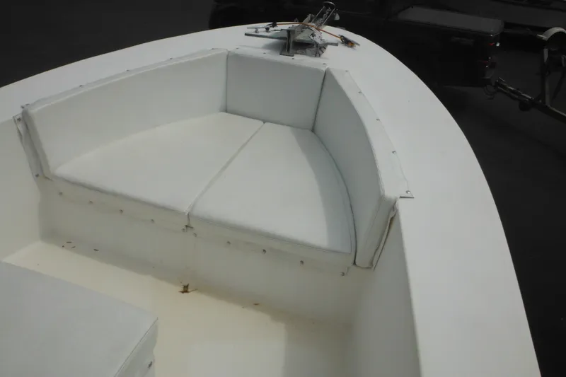 Slide: The Image of 2006 DC 23 DC Brown Custom CC boat with white cushioned seating area. - 29