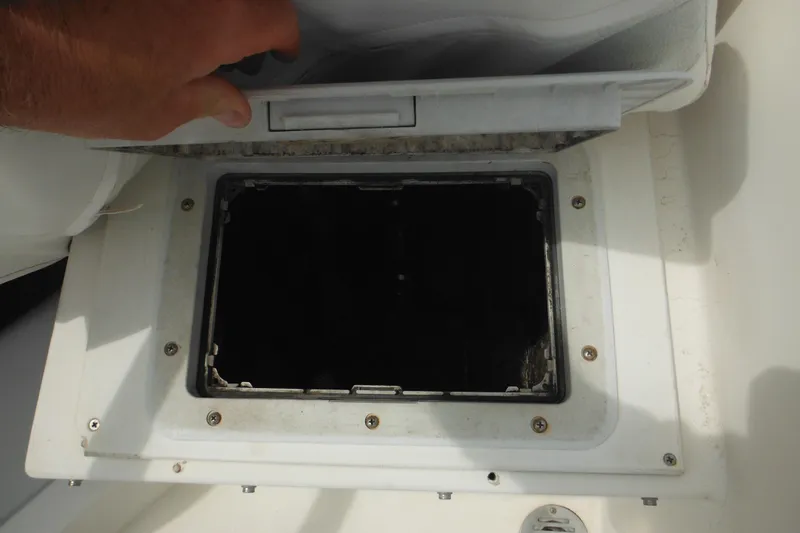 Slide: The Image of Open hatch on 2006 DC 23 DC Brown Custom CC boat, showing interior compartment. - 38