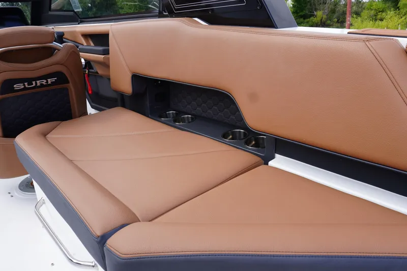 Slide: The Image of 2025 Cobalt R8 Surf boat interior with tan leather seating and cup holders. - 11