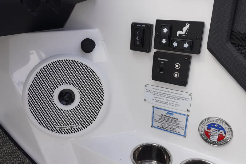 Slide: The Image of Control panel and speaker on 2025 Cobalt R8 Surf boat interior. - 13