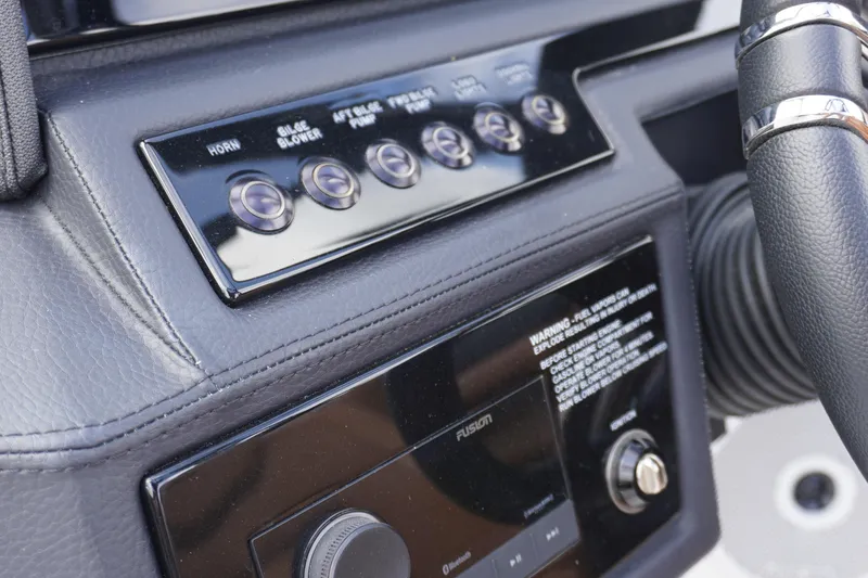 Slide: The Image of 2025 Cobalt R8 Surf dashboard with control buttons and steering wheel detail. - 14