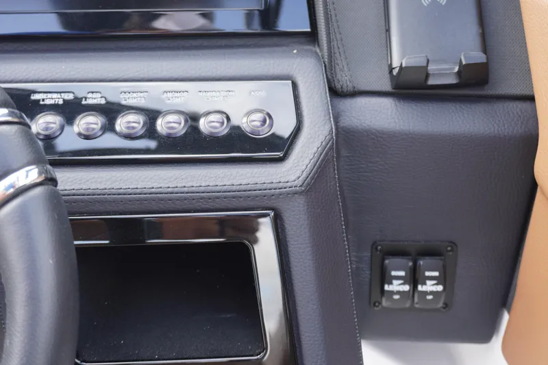 Slide: The Image of 2025 Cobalt R8 Surf dashboard with control panel and switches. - 15