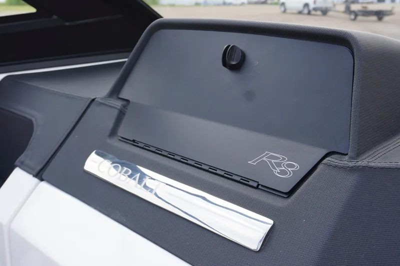 Slide: The Image of 2025 Cobalt R8 Surf boat dashboard with sleek design and branding. - 16