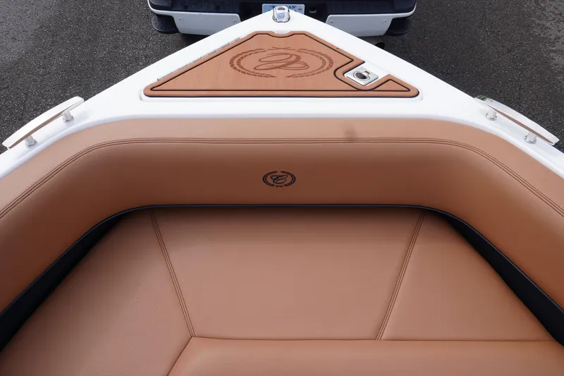 Slide: The Image of 2025 Cobalt R8 Surf boat interior with tan leather seating and logo detail. - 20