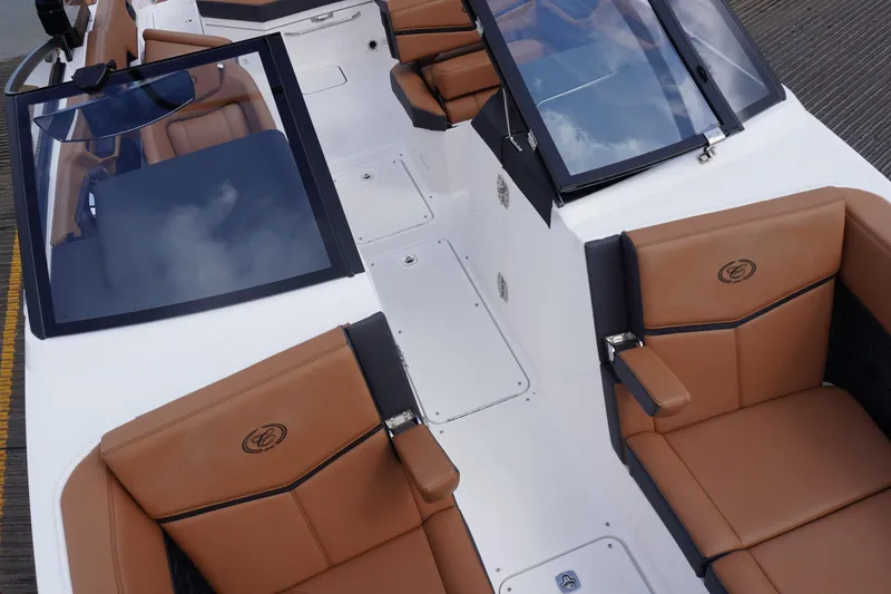Slide: The Image of 2025 Cobalt R8 Surf boat interior with tan leather seats and sleek design. - 21