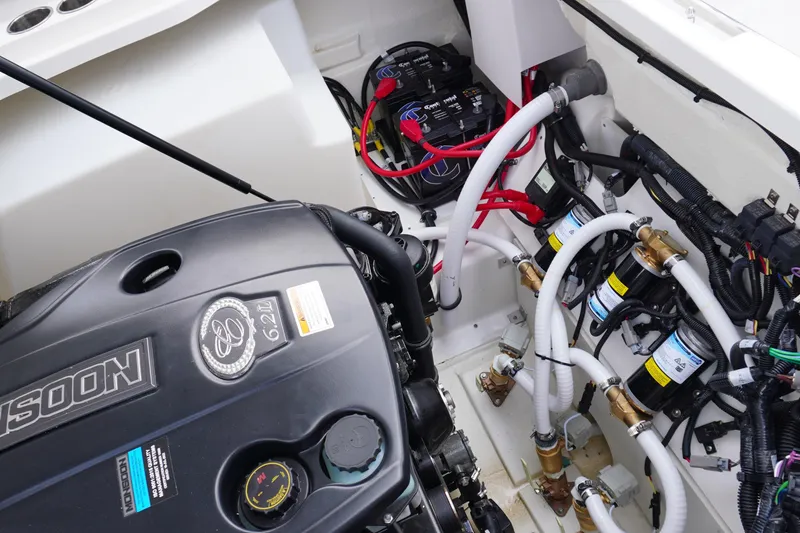 Slide: The Image of Engine compartment of 2025 Cobalt R8 Surf boat, showcasing detailed wiring and components. - 25