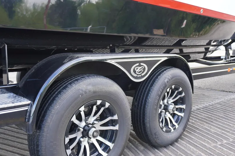 Slide: The Image of Trailer wheels of a 2025 Cobalt R8 Surf boat, featuring stylish rims and logo. - 3