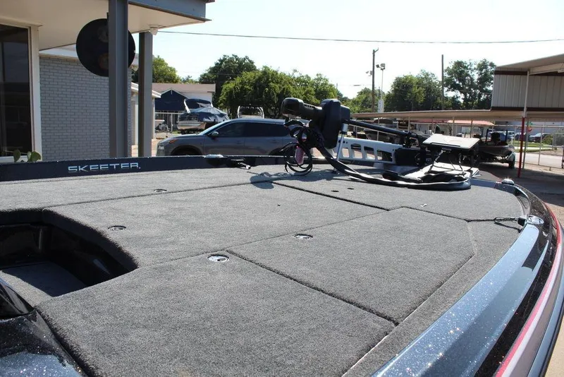 Slide: The Image of 2026 Skeeter ZXE20 boat deck with mounted equipment in a sunny outdoor setting. - 16