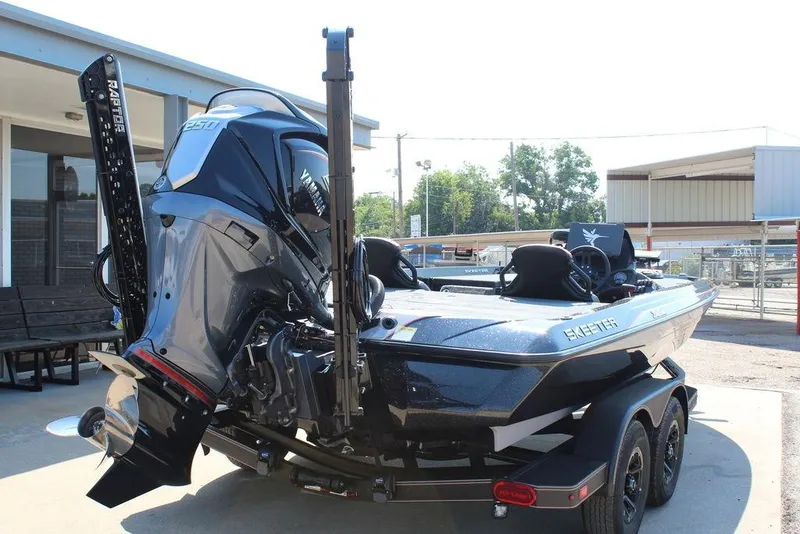 Slide: The Image of 2026 Skeeter ZXE20 boat with Yamaha engine, parked on a trailer in a sunny outdoor setting. - 6