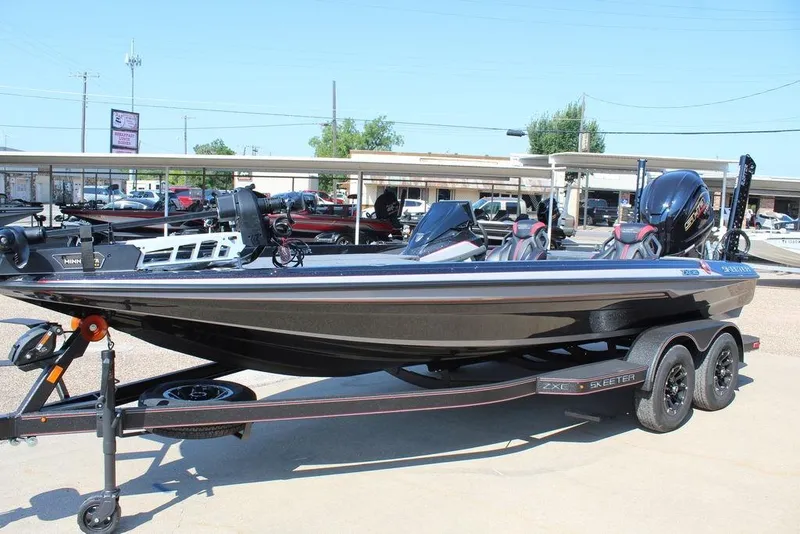 Slide: The Image of 2026 Skeeter ZXE20 boat on trailer, sleek design, parked outdoors. - 9