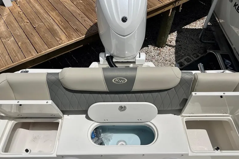 Slide: The Image of 2026 Key West 219 FS boat interior with seating and storage compartments. - 17