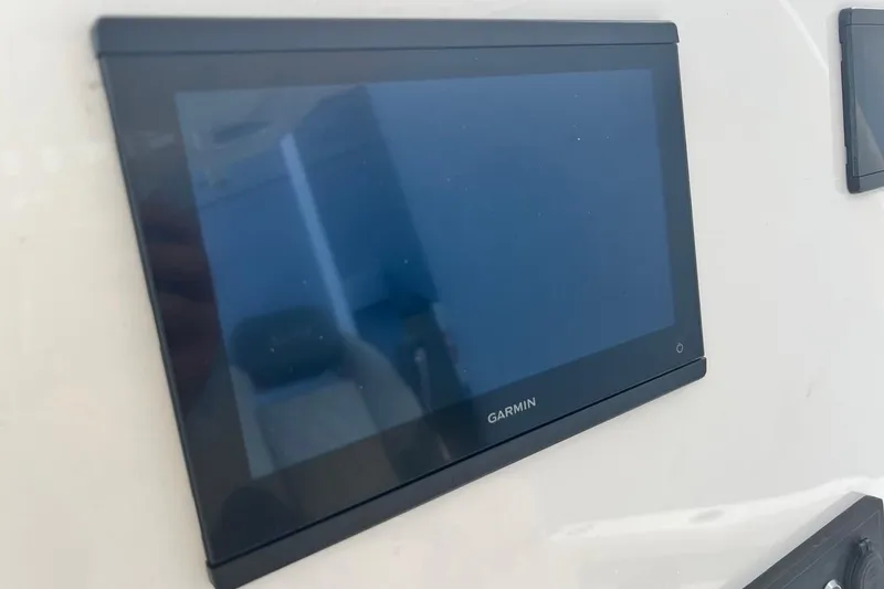 Slide: The Image of Garmin display on 2026 Key West 219 FS boat dashboard. - 24