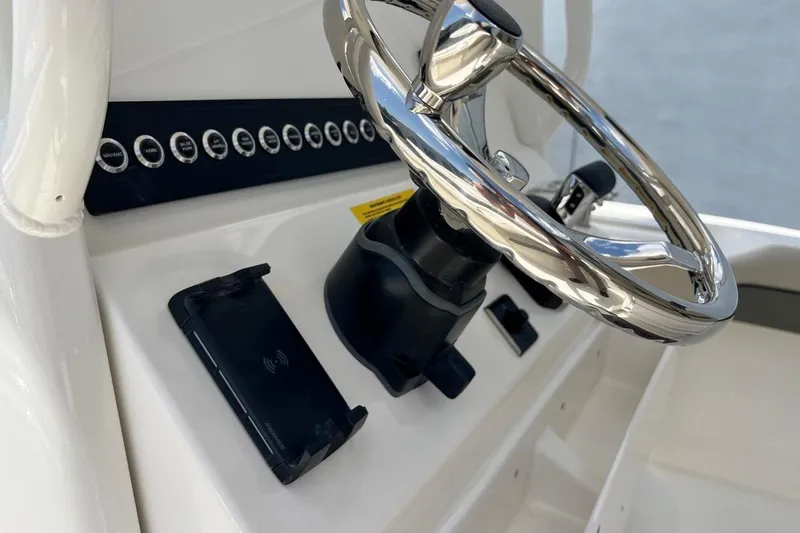 Slide: The Image of Steering wheel and controls of 2026 Key West 219 FS boat. - 26