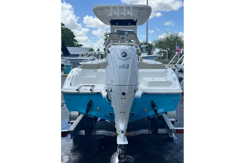 Slide: The Image of 2026 Key West 219 FS boat with Yamaha 150 engine, displayed outdoors. - 3