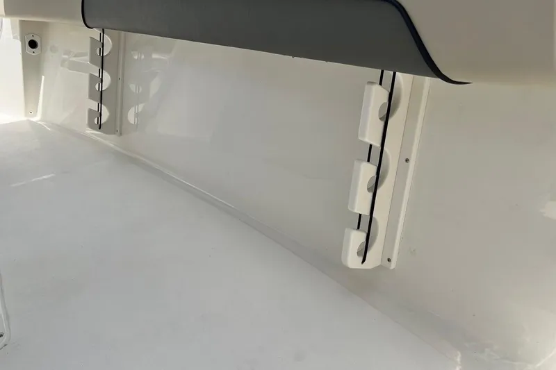 Slide: The Image of Interior view of 2026 Key West 219 FS boat, featuring rod holders and sleek design. - 32