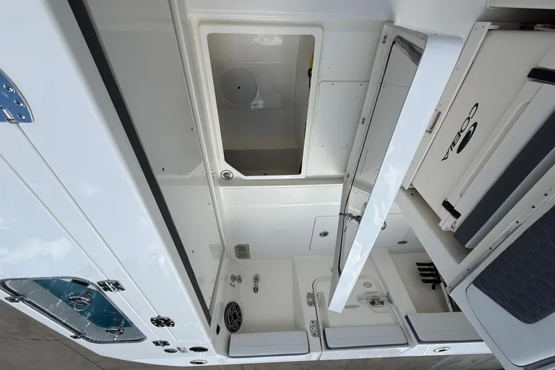 Slide: The Image of 2026 Cobia 305 Center Console interior with storage compartments and seating. - 13