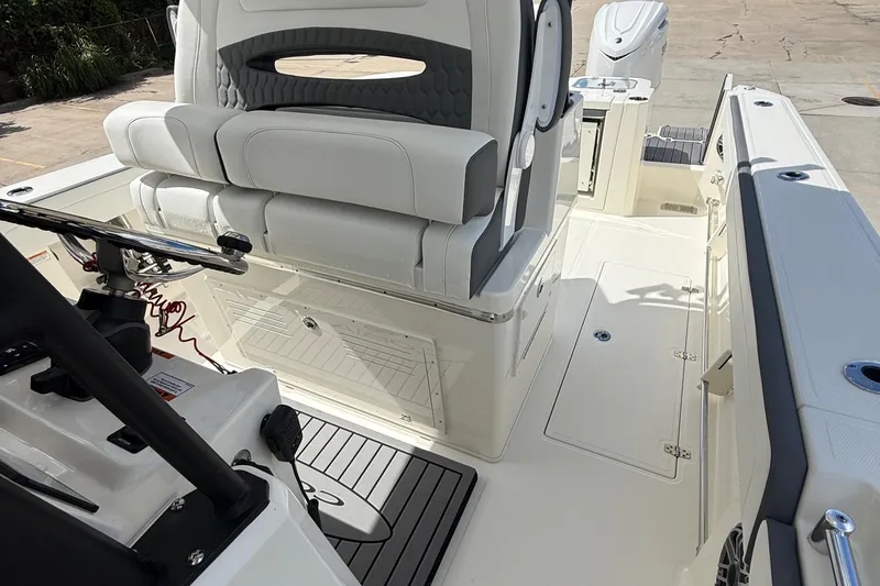 Slide: The Image of 2026 Cobia 305 Center Console boat interior with sleek seating and modern design. - 19