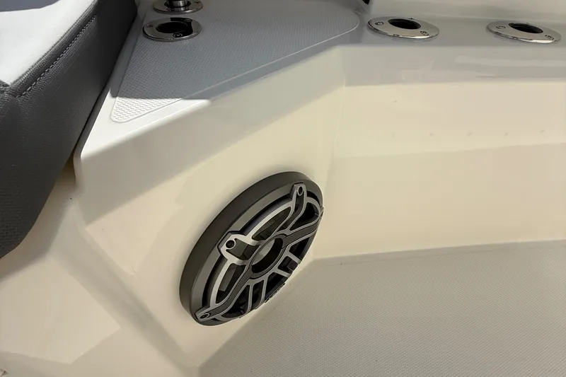 Slide: The Image of Speaker and seating detail on 2026 Cobia 305 Center Console boat. - 25