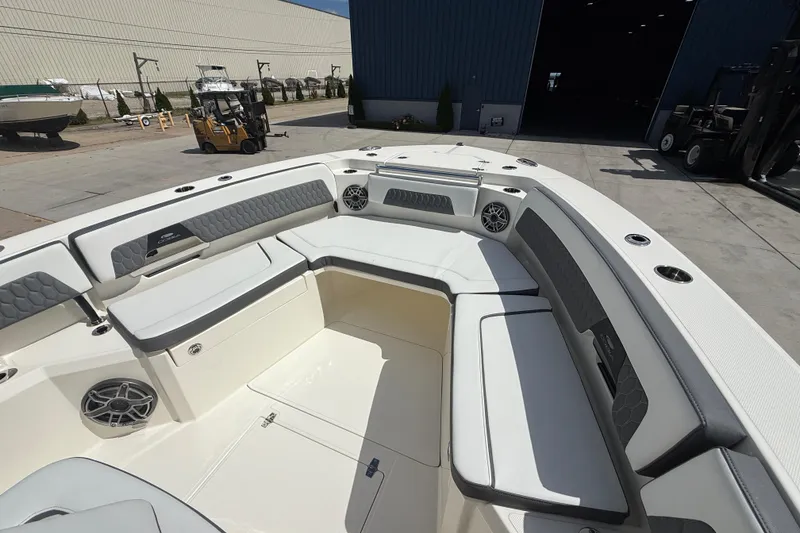 Slide: The Image of 2026 Cobia 305 Center Console boat with spacious seating and modern design. - 26