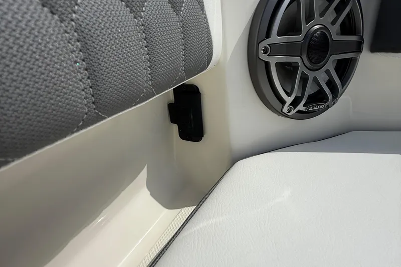 Slide: The Image of Speaker and seating detail on 2026 Cobia 305 Center Console boat. - 39