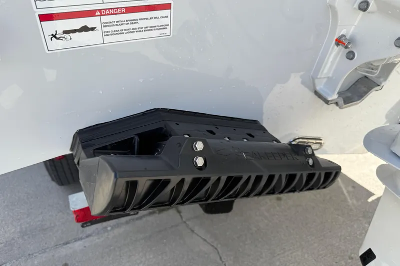 Slide: The Image of 2026 Cobia 305 Center Console boat with Seakeeper stabilizer detail. - 46