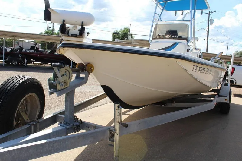 Slide: The Image of 2002 Blue Wave 2200 DELUXE CC boat on trailer, parked outdoors. - 11